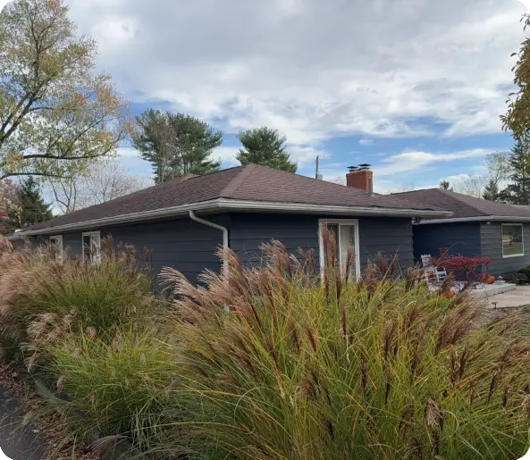 Gutter installation on a small home, rounded