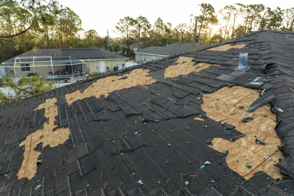 roof damage by a storm in need of spring storm damage restoration