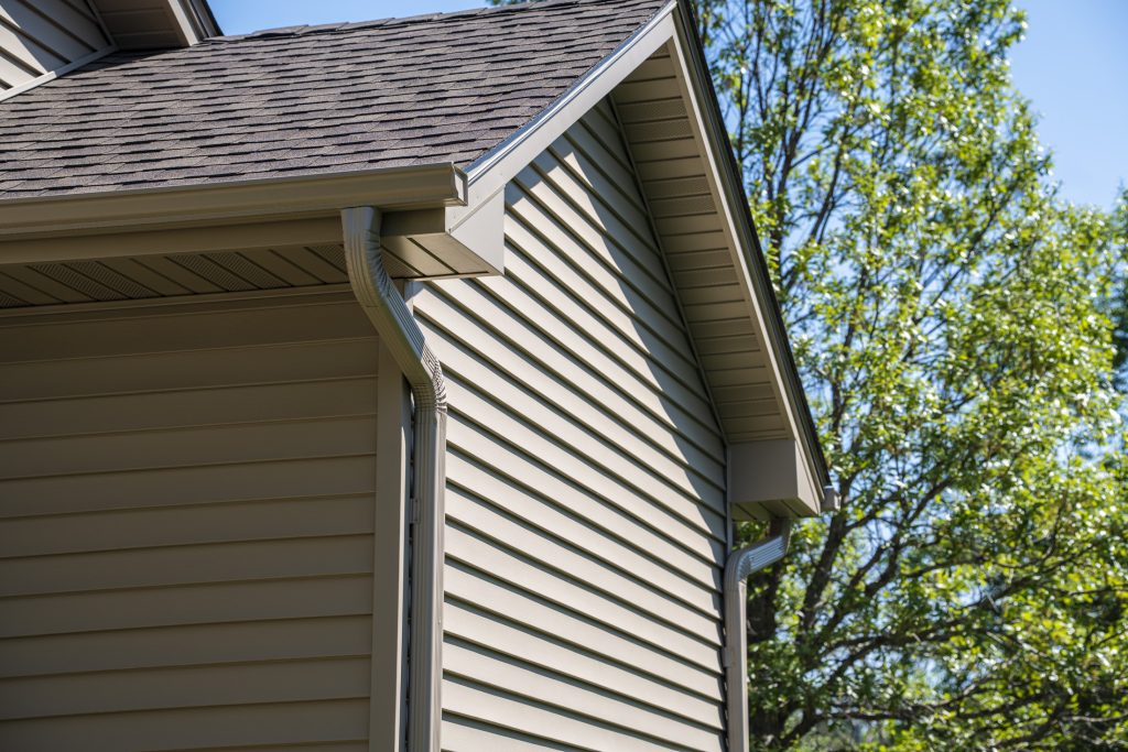 Close-up of Hardie board siding texture, prompting the question: how much is Hardie board siding?